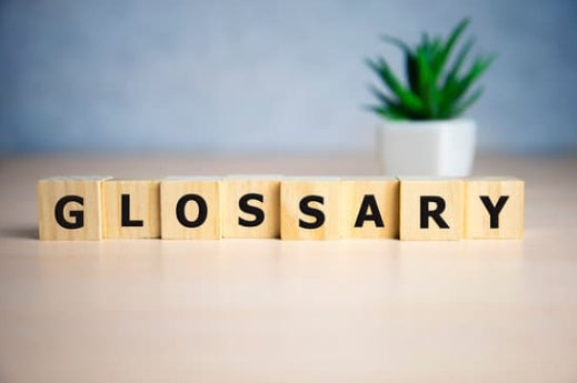 Wooden blocks spelling GLOSSARY on article about the most comprehensive opal glossary