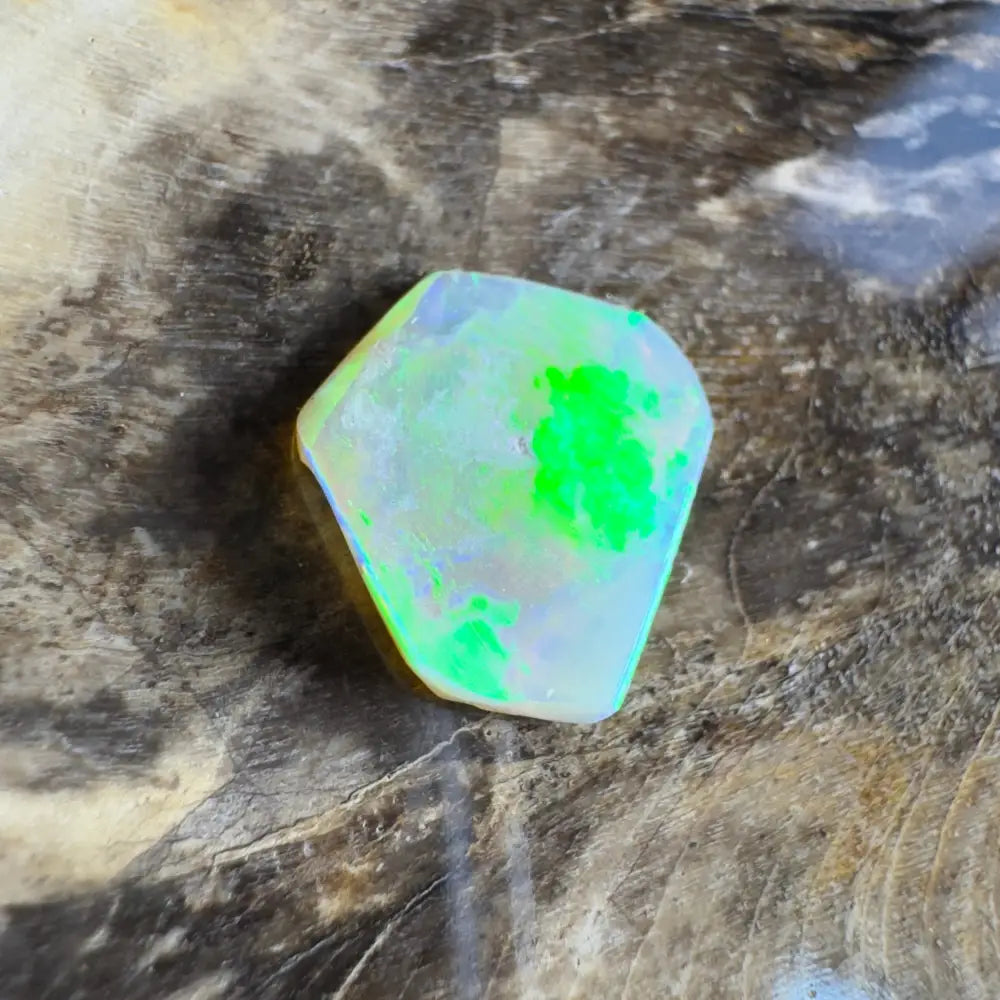 Iridescent opal gemstone with green flash.