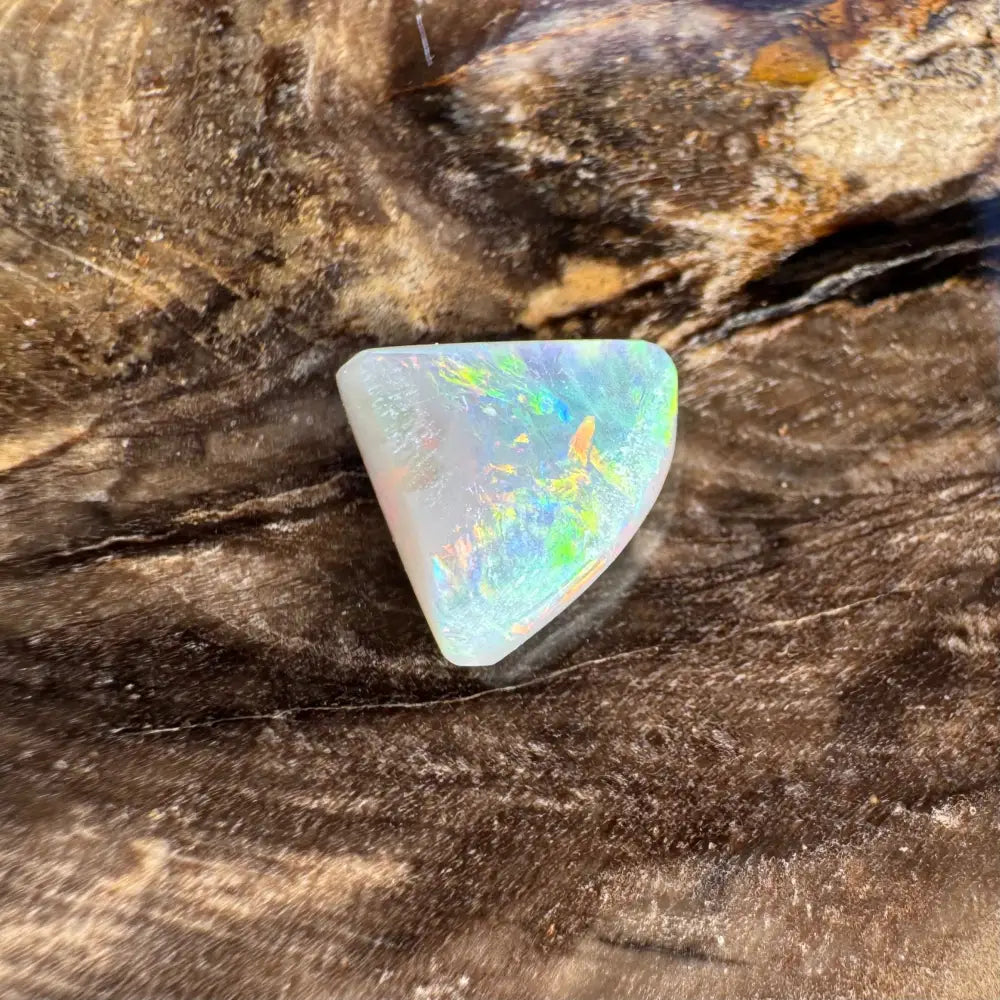 Iridescent triangular 1.0 carat Hand-Cut Solid Lightning Ridge Semi Black Opal gemstone