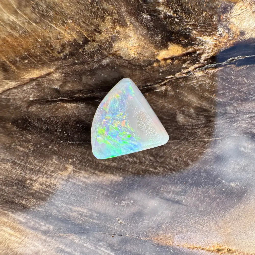 Iridescent triangular lightning ridge semi black opal in 1.0 carat hand-cut solid display