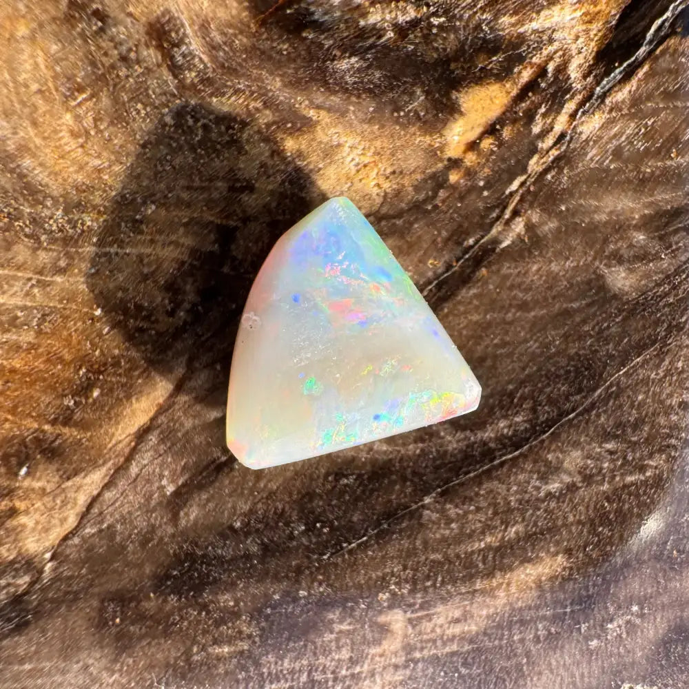 Iridescent triangular opal cabochon from 1.0 carat Hand-Cut Solid Lightning Ridge Semi Black Opal