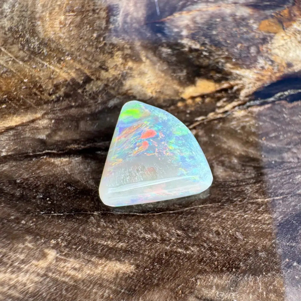 Iridescent triangular opal in the 1.0 carat Hand-Cut Solid Lightning Ridge Semi Black Opal jewelry piece