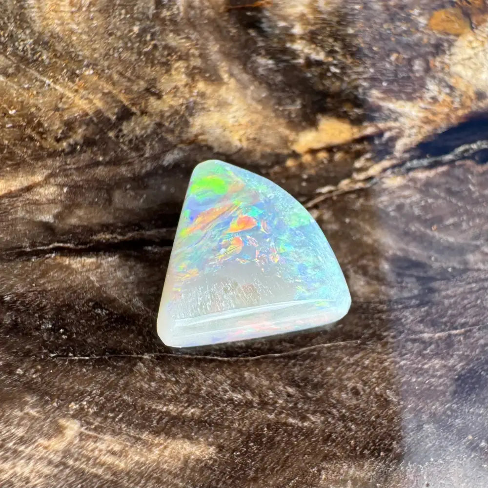 Iridescent triangular opal gemstone in the 1.0 carat Hand-Cut Solid Lightning Ridge Semi Black Opal