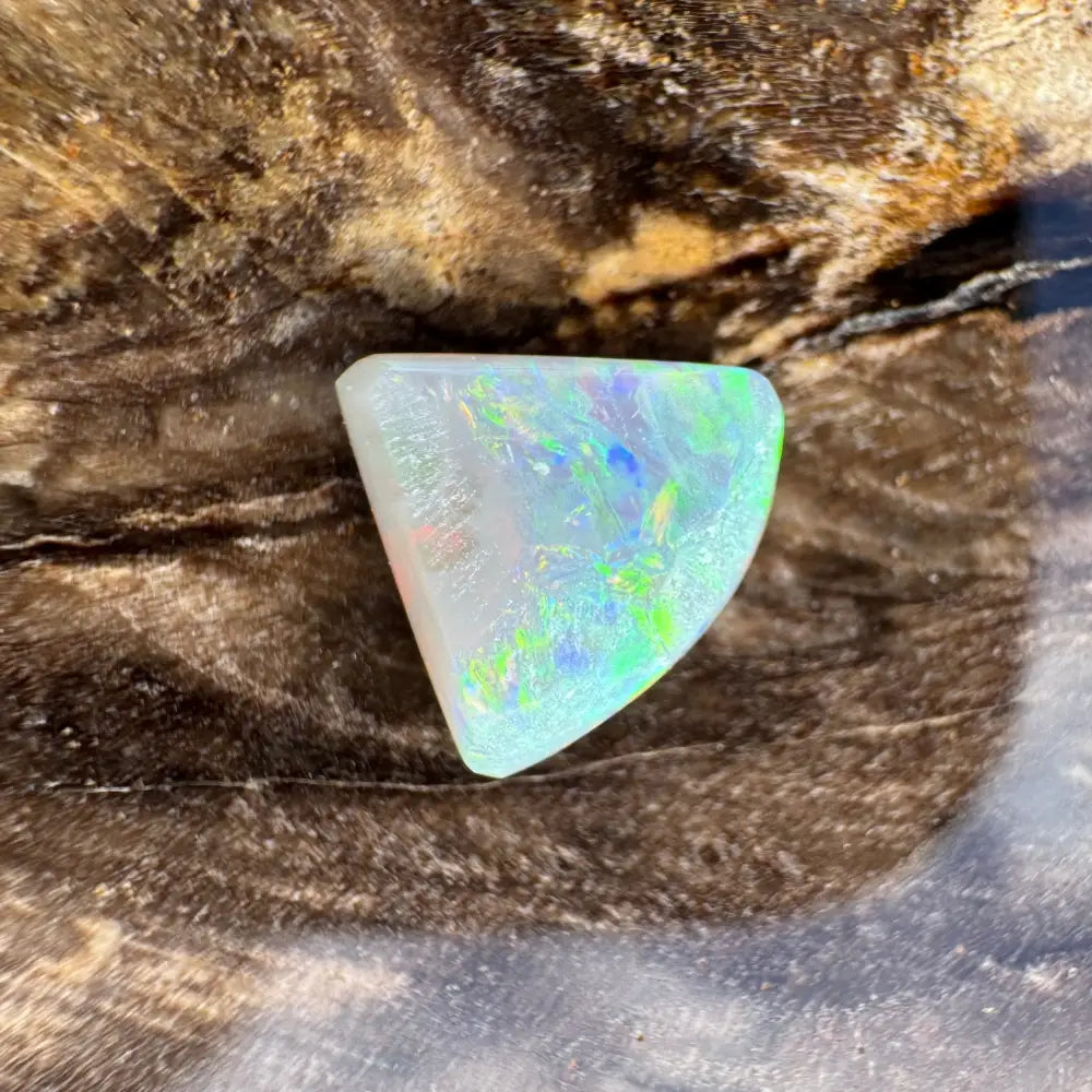 Iridescent opal gemstone from Lightning Ridge in a 1.0 carat hand-cut semi black opal