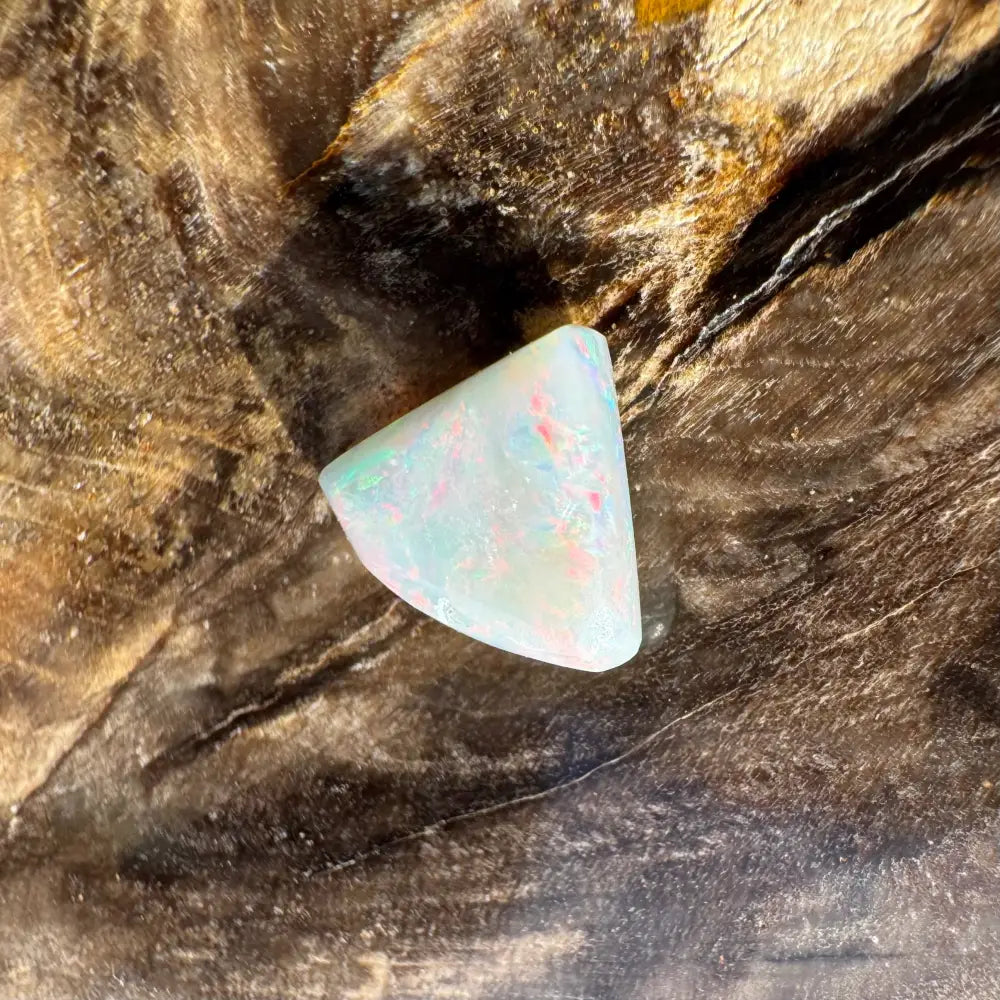 Iridescent opal gemstone from Lightning Ridge in 1.0 carat hand-cut solid semi-black opal display