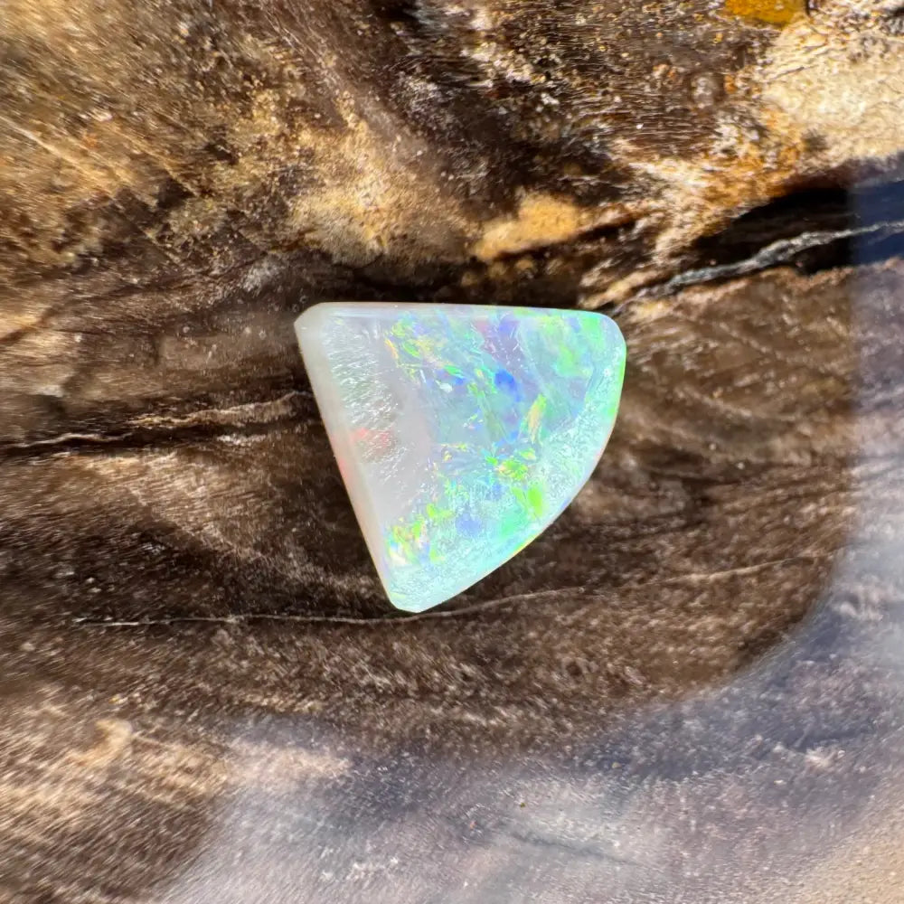Ir IDscent triangular opal gemstone from Lightning Ridge in 1.0 carat hand-cut semi-black opal product