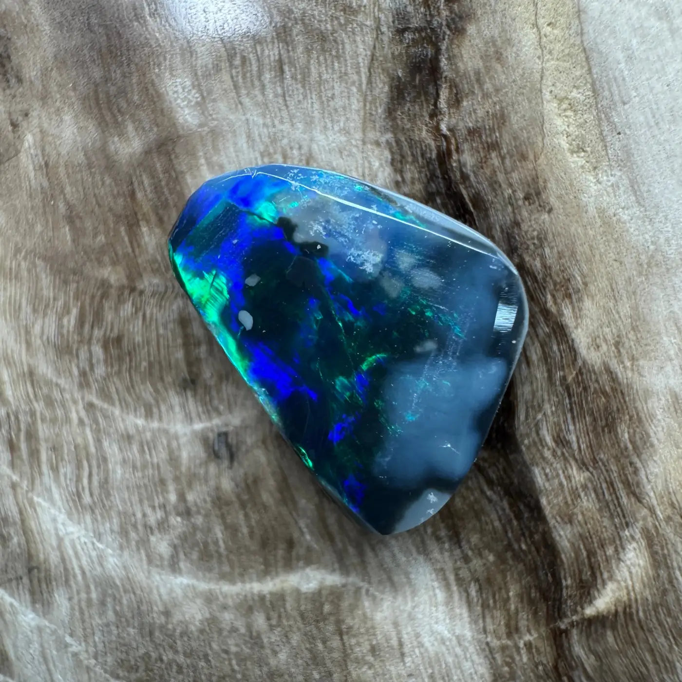 Iridescent black opal gemstone from Lightning Ridge in the 1.2ct Hand-Cut Solid Black Opal product