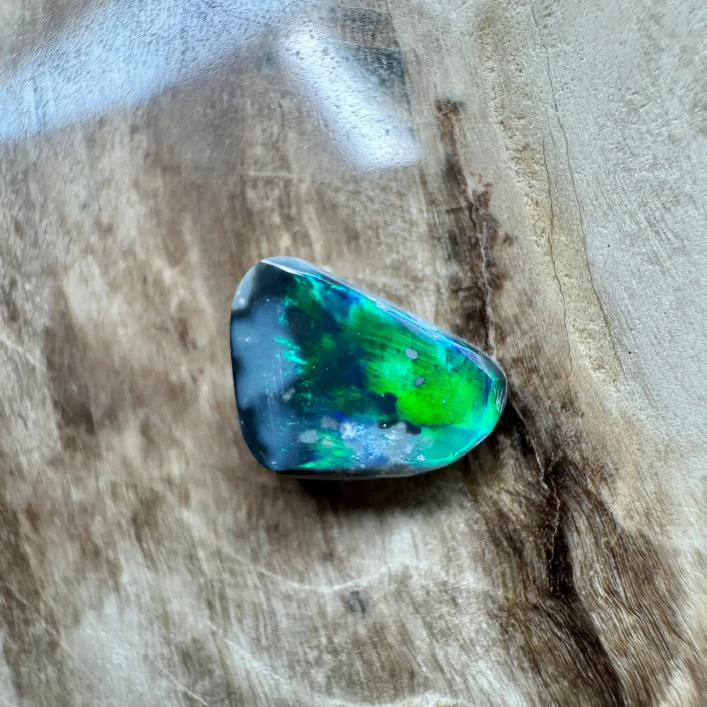 Iridescent Opal Gemstone from Lightning Ridge in a 1.2ct Hand-Cut Solid Black Opal