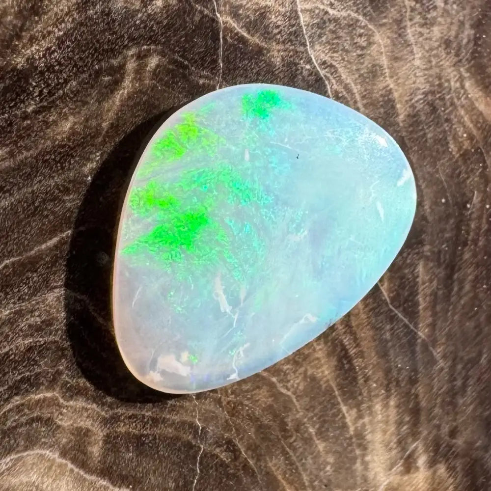 Iridescent opal gemstone with green flash.