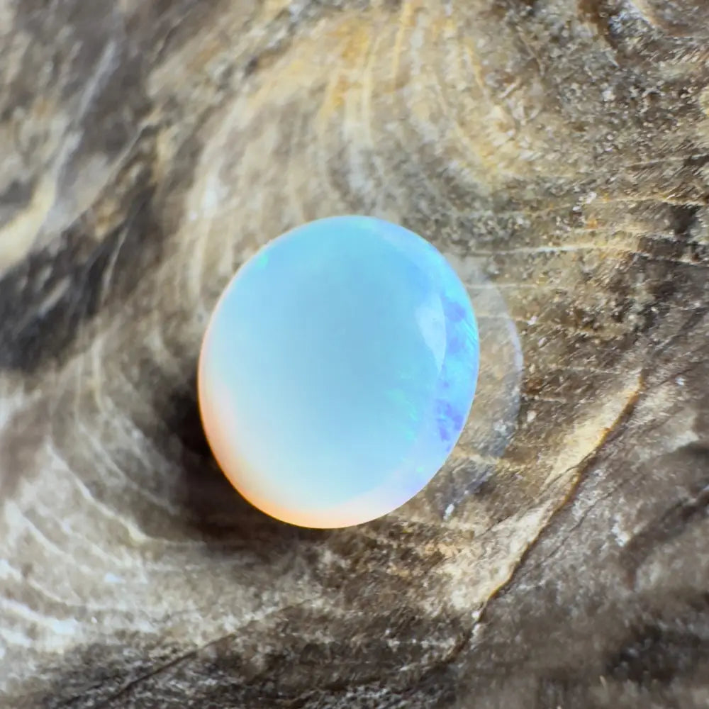 Opalescent oval gemstone.