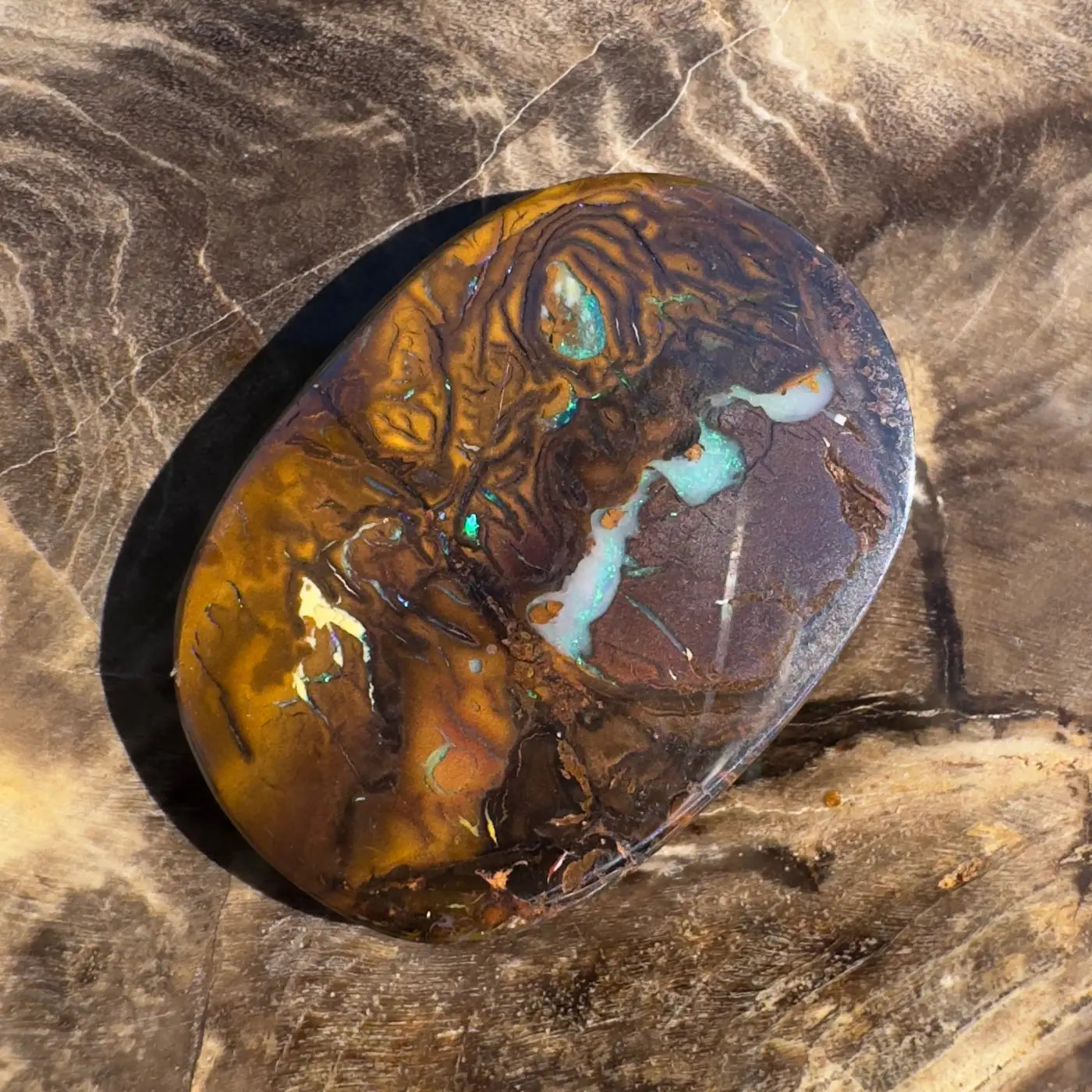 Polished 15.9ct Hand-Cut Solid Boulder Opal showcasing vibrant color play