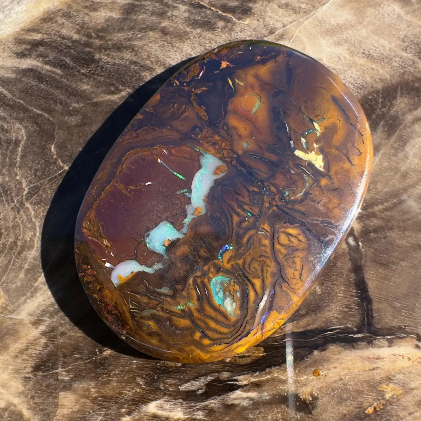 Polished Boulder Opal with brown and blue inclusions in a 15.9ct hand-cut solid gemstone