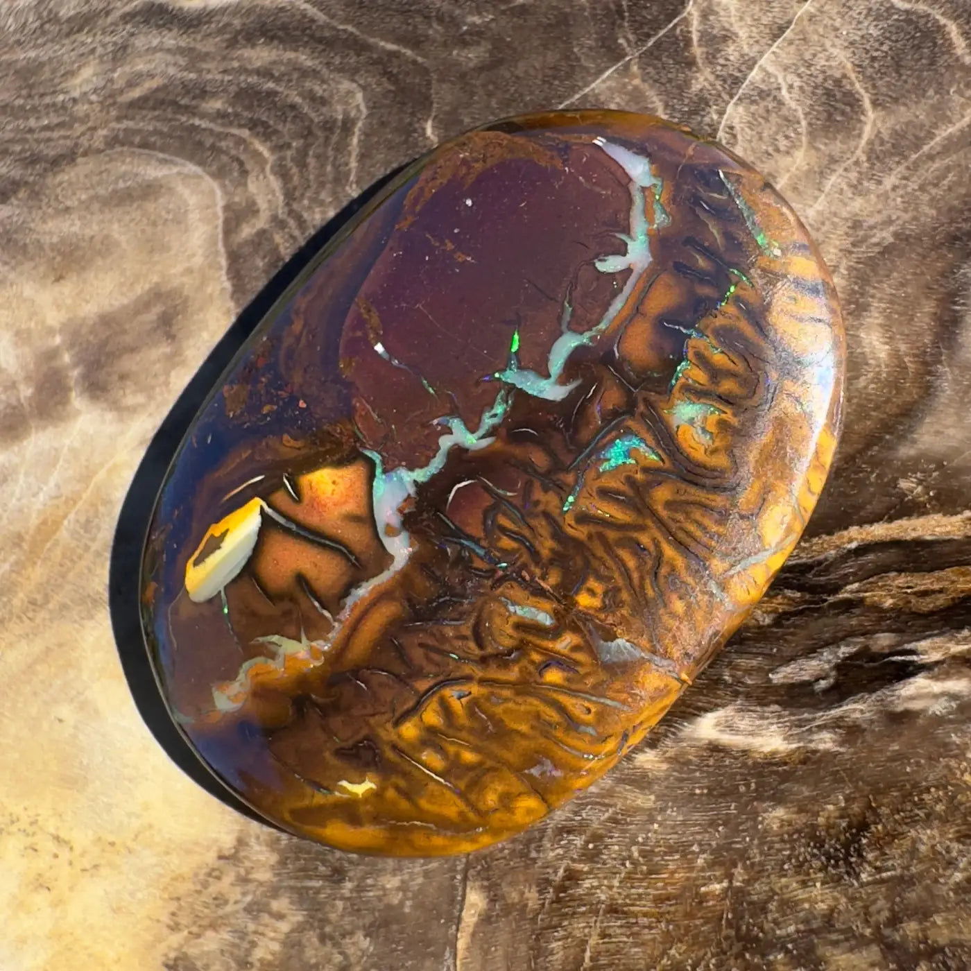 Polished 15.9ct Hand-Cut Solid Boulder Opal showcasing vibrant color play