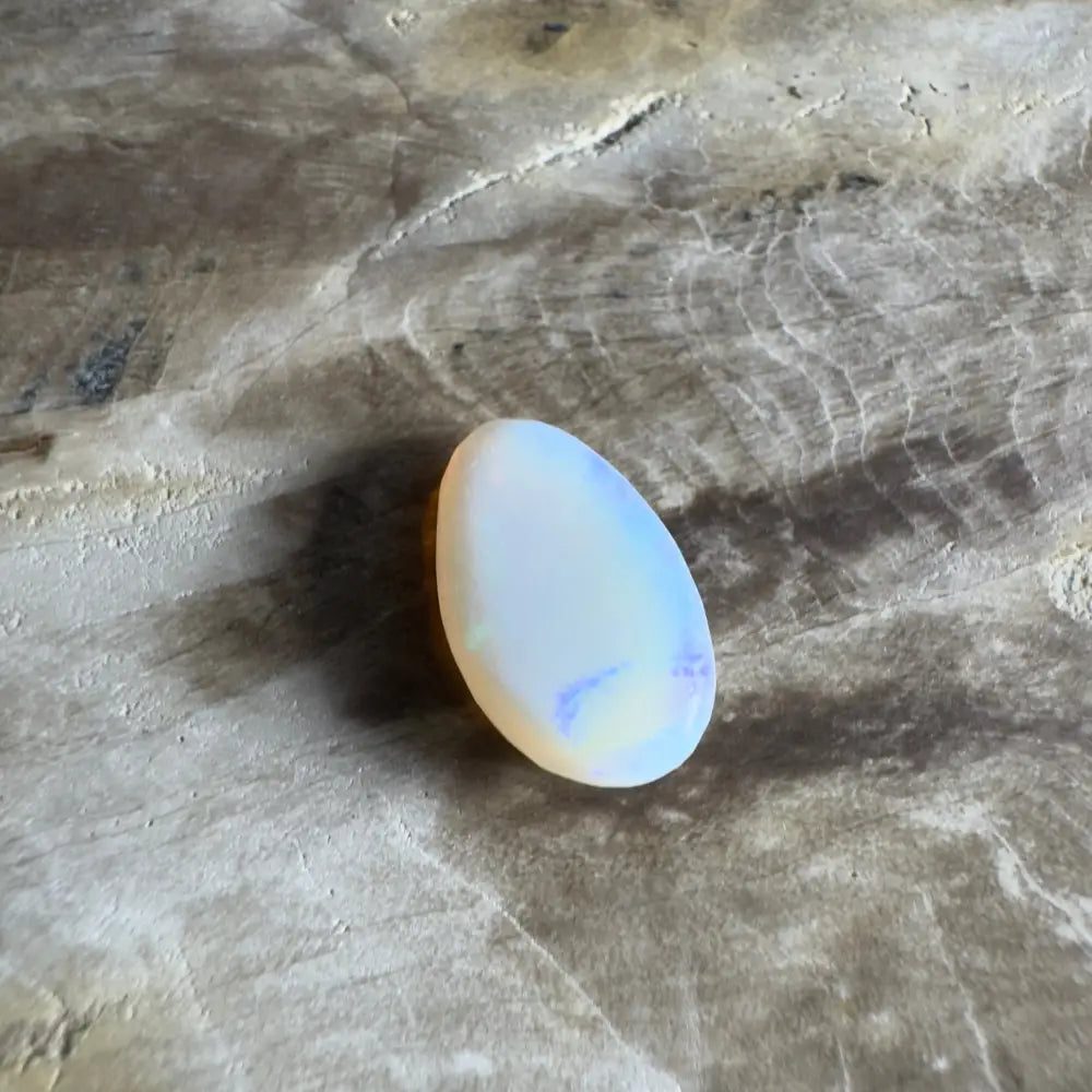 Iridescent, oval-shaped opal.