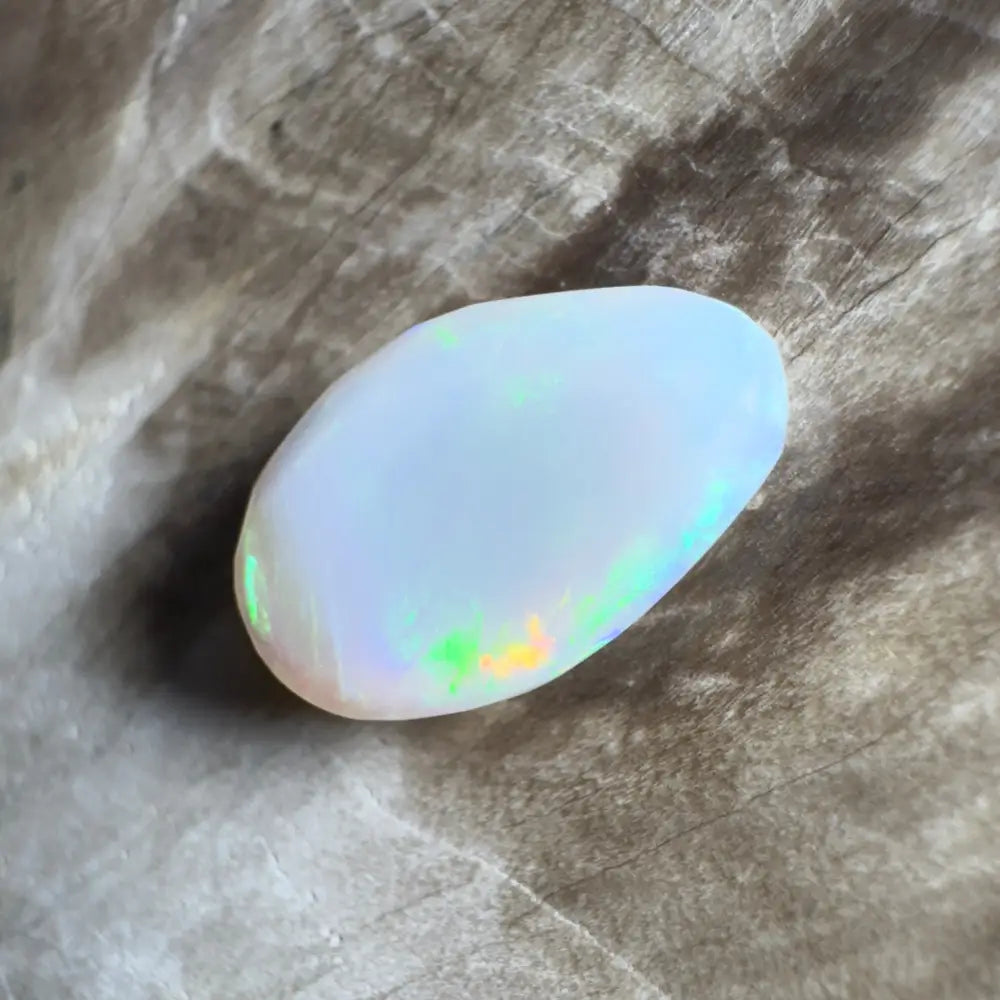 Iridescent white opal cabochon.