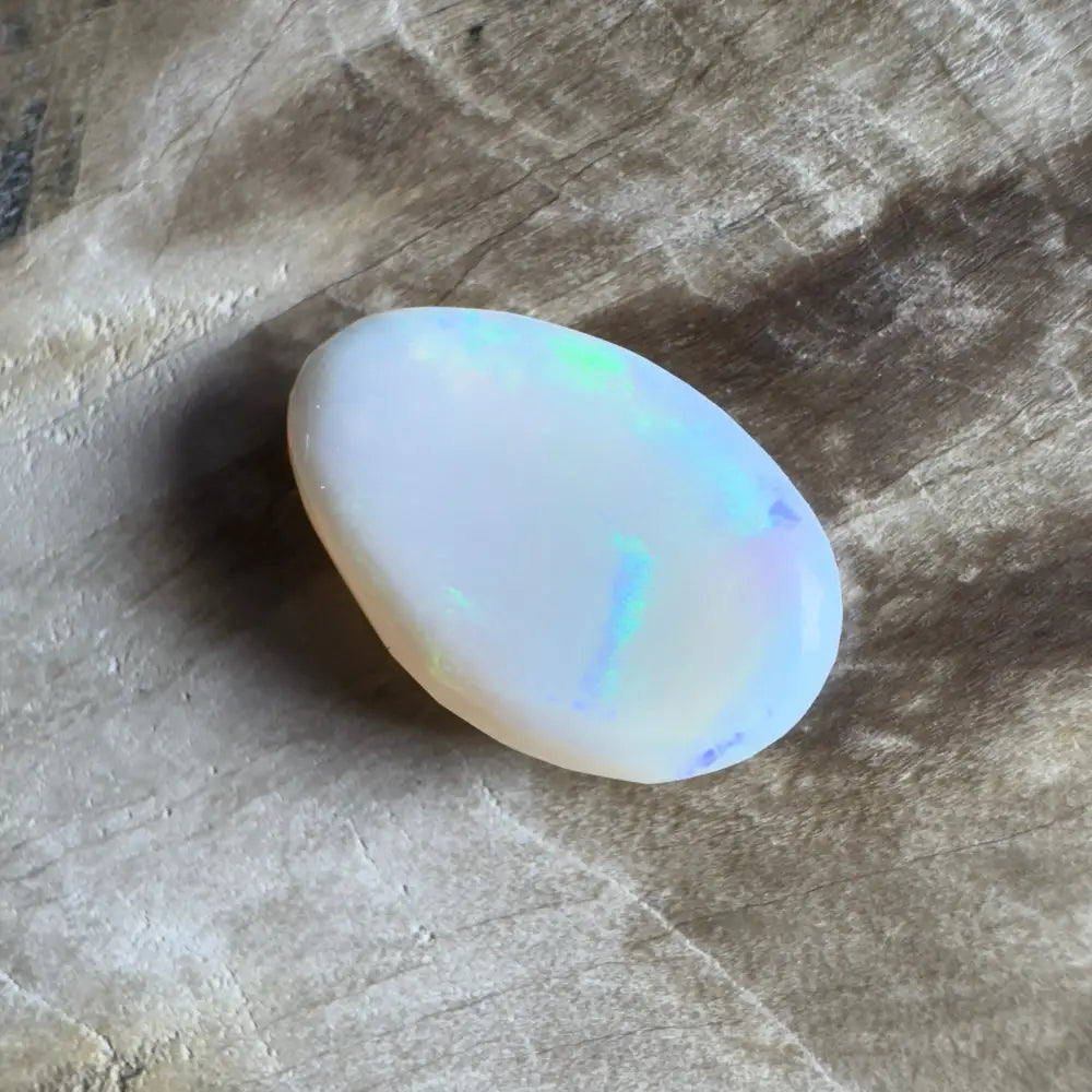 Iridescent white opal cabochon.