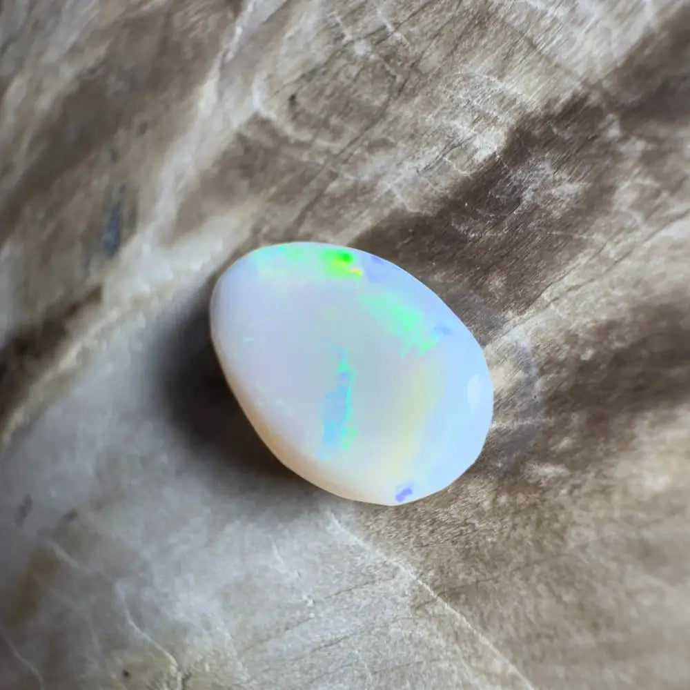 Iridescent white opal cabochon.