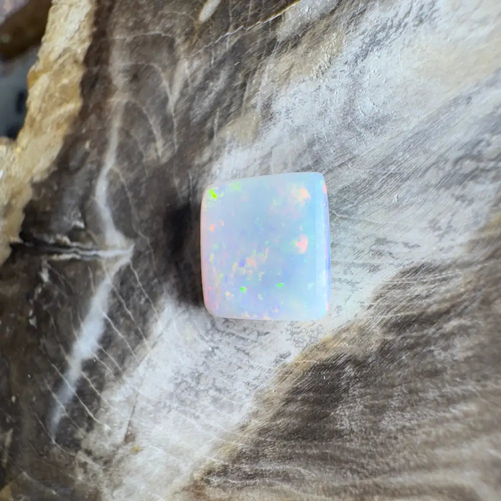 Iridescent white opal cabochon.
