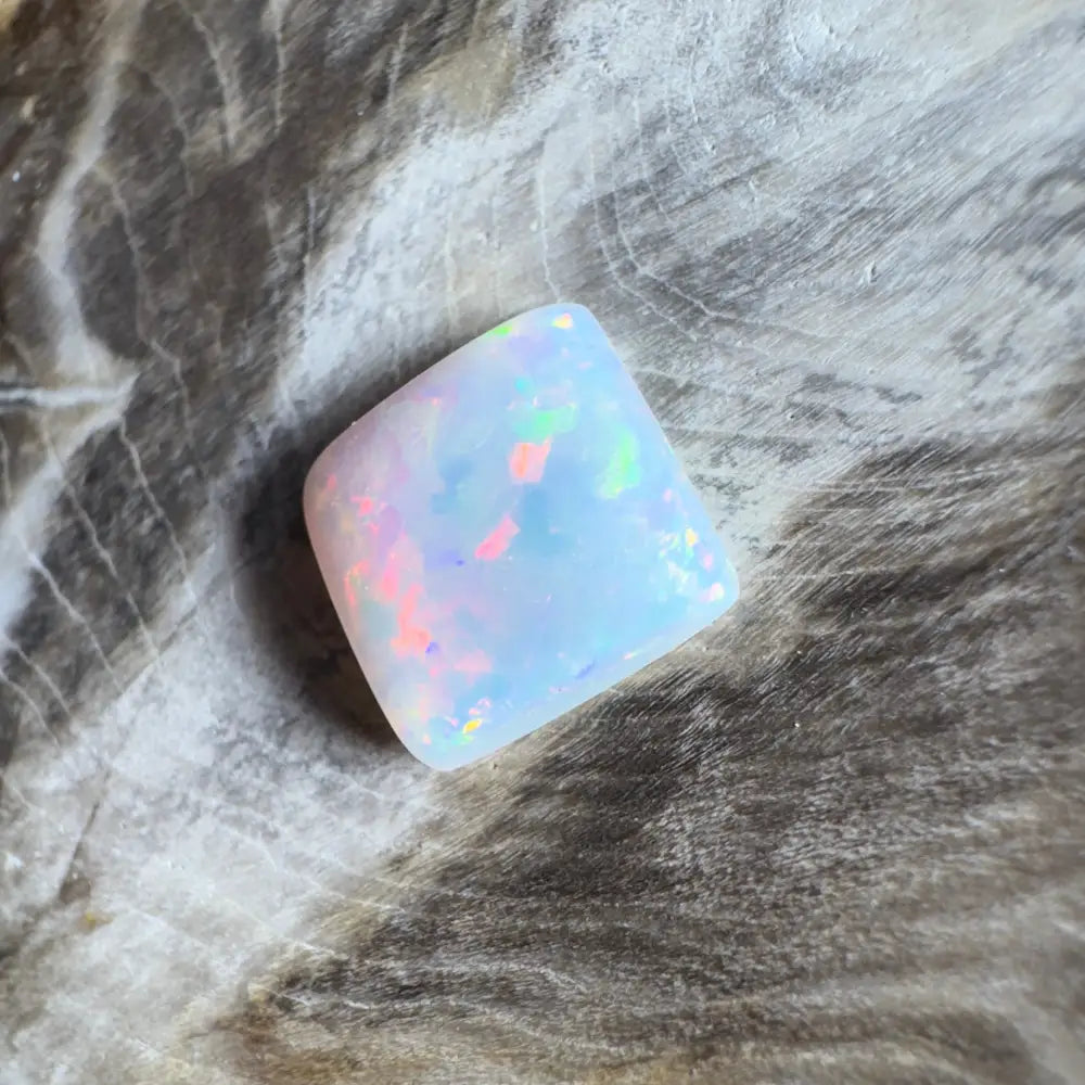 Iridescent white opal cabochon.