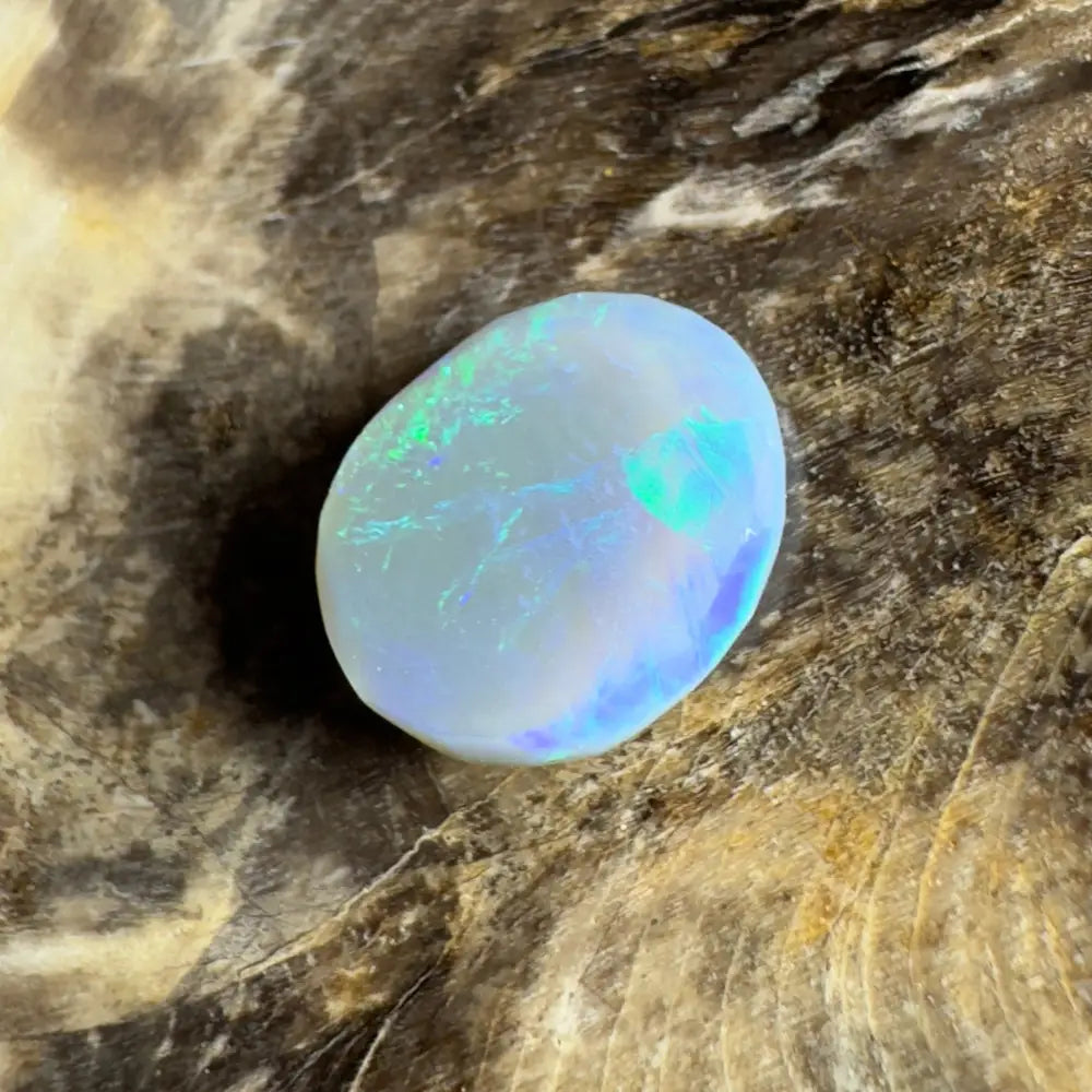Iridescent, oval opal cabochon.
