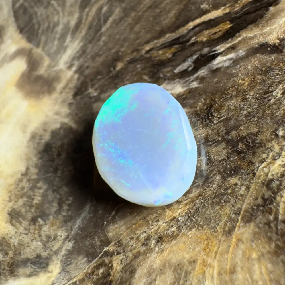 Iridescent white opal cabochon.