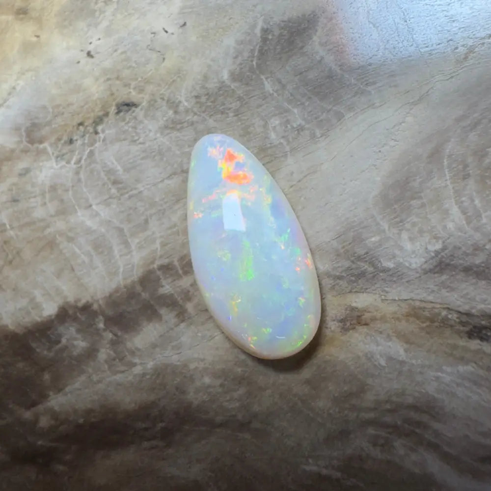 Iridescent teardrop-shaped opal.