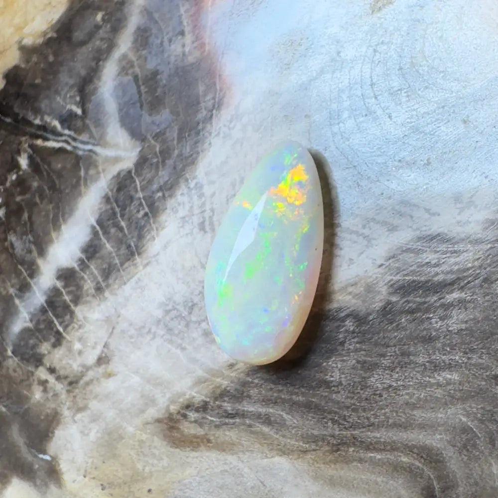 Iridescent white opal gemstone.