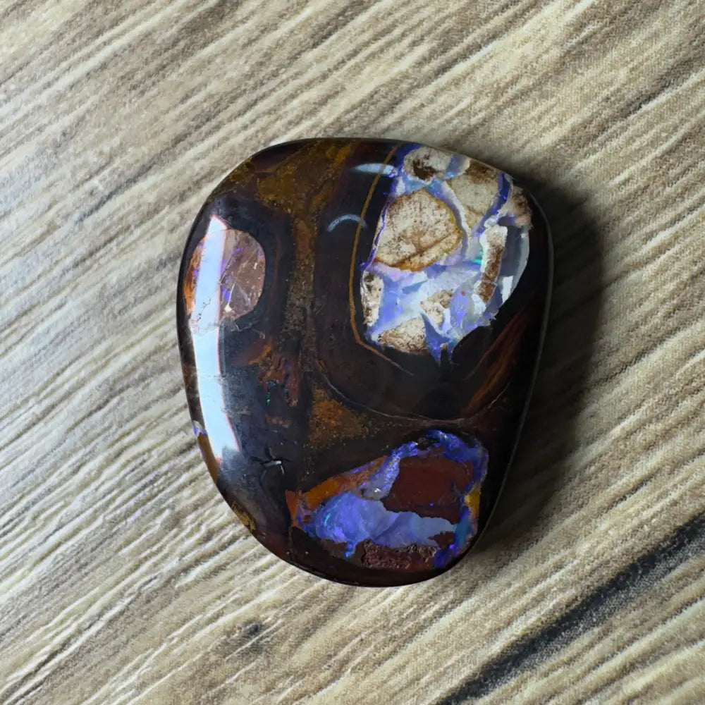 Polished Boulder Opal with vibrant color play from Queensland in 21.9ct hand-cut display