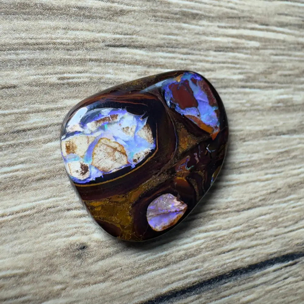 Polished 21.9ct Hand-cut Queensland Boulder Opal with vibrant color play and natural pipes