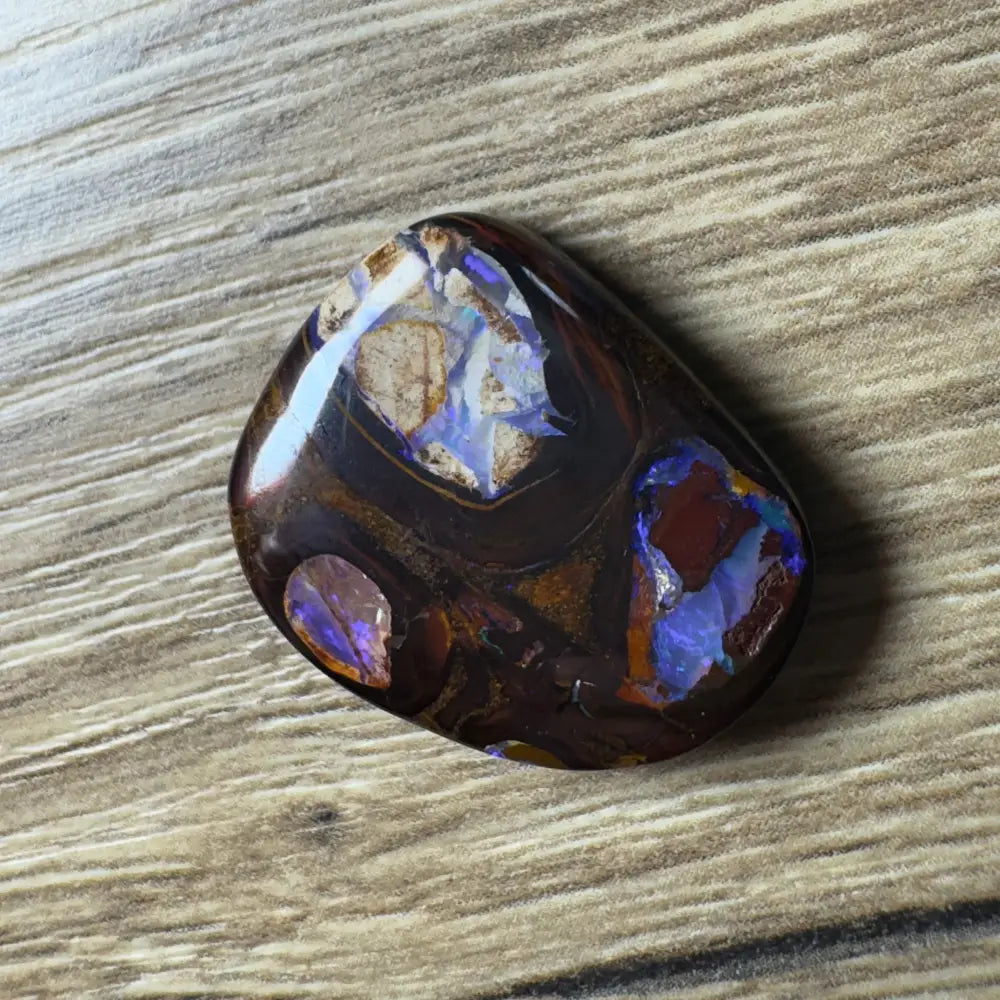Polished Boulder Opal cabochon from Queensland in the 21.9ct Hand-cut Boulder Opal with Pipes product