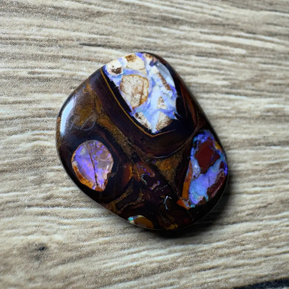 Polished Queensland Boulder Opal with vibrant play-of-color in a 21.9ct hand-cut piece