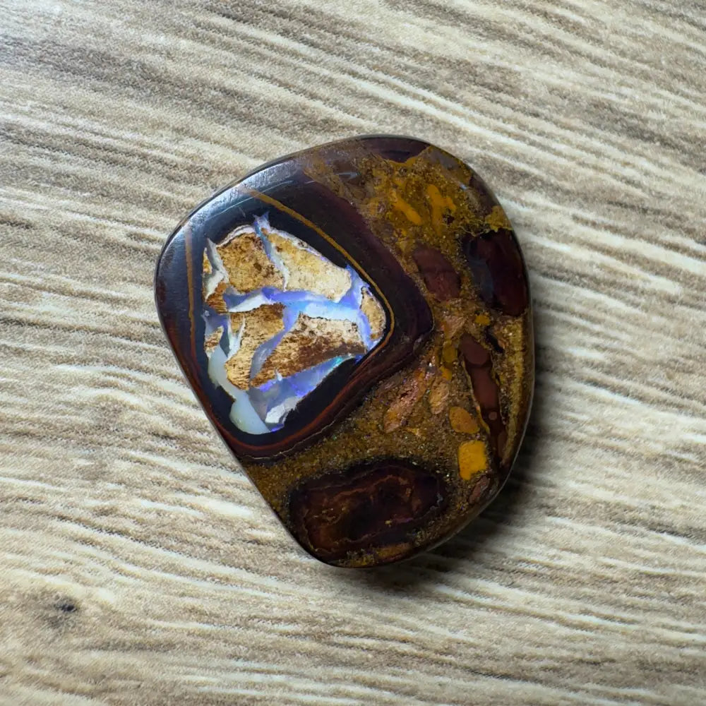 Polished Boulder Opal showcasing blue and brown hues from Queensland in a 21.9ct hand-cut specimen