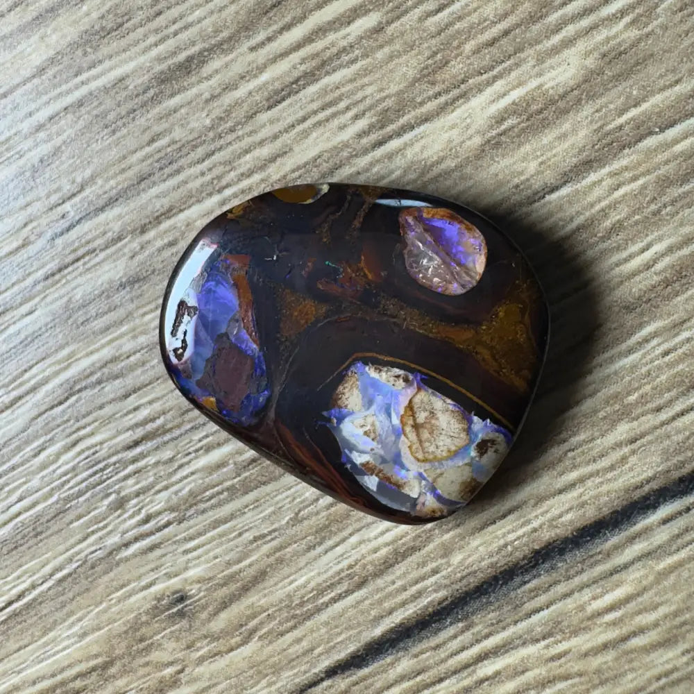 Polished 21.9ct Hand-cut Queensland Boulder Opal with vibrant color play and unique pipes