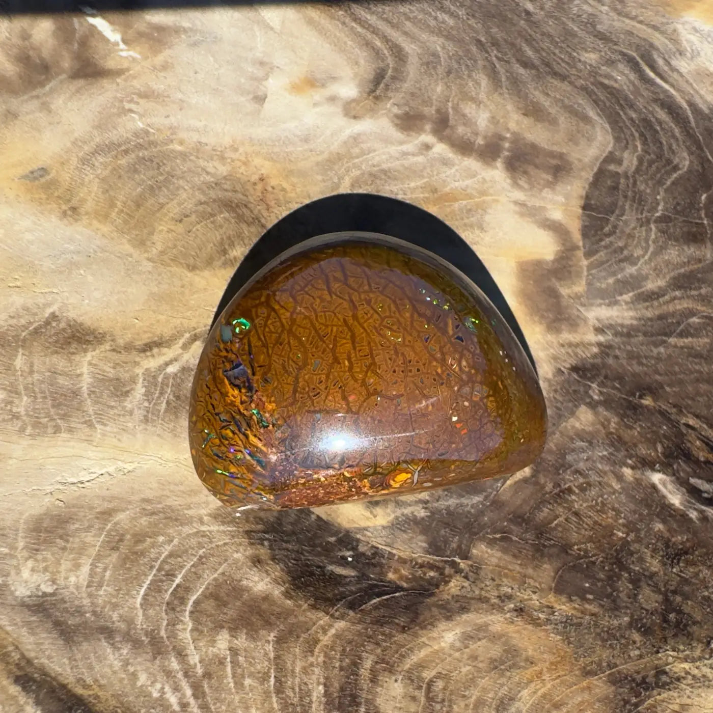 Polished brown Opal cabochon from the 24.6ct Hand-Cut Solid Boulder Opal collection