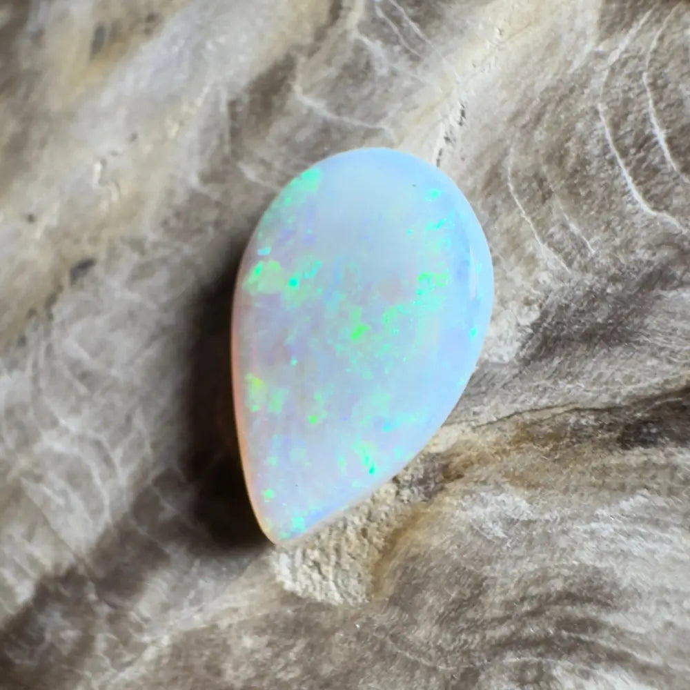 Iridescent teardrop-shaped opal.