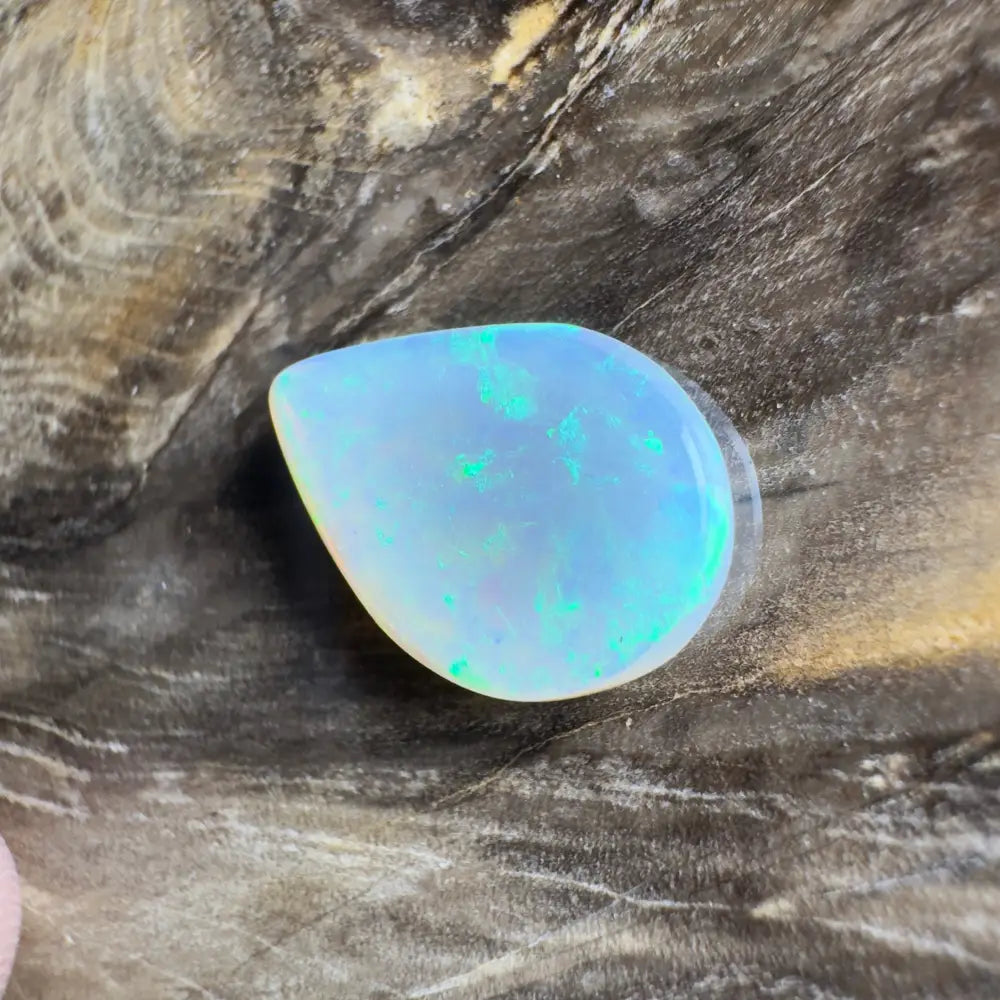 Iridescent teardrop-shaped opal.