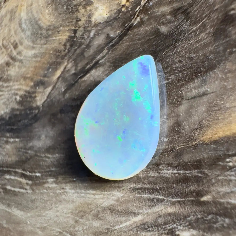 Iridescent teardrop-shaped opal.