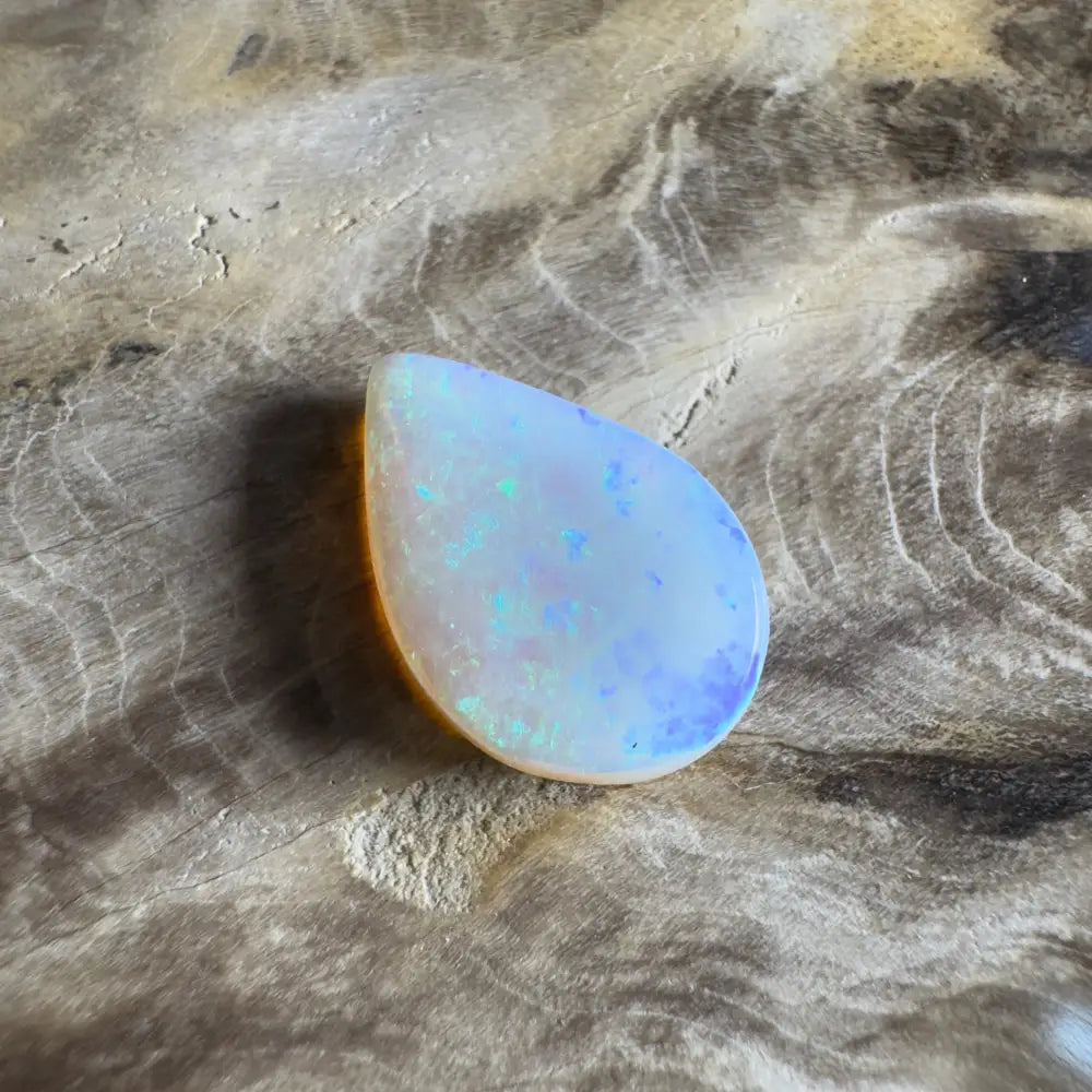 Iridescent teardrop-shaped opal.