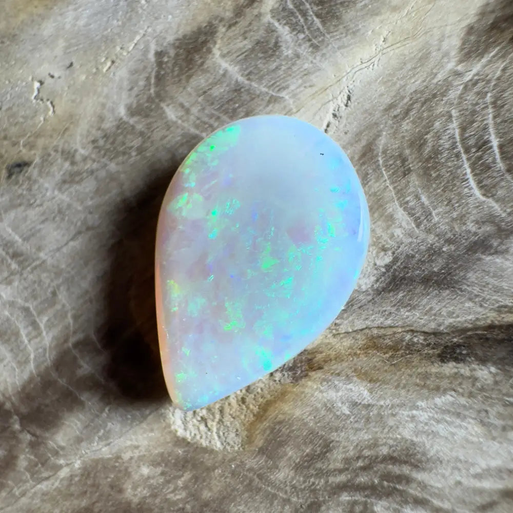 Iridescent teardrop-shaped opal.