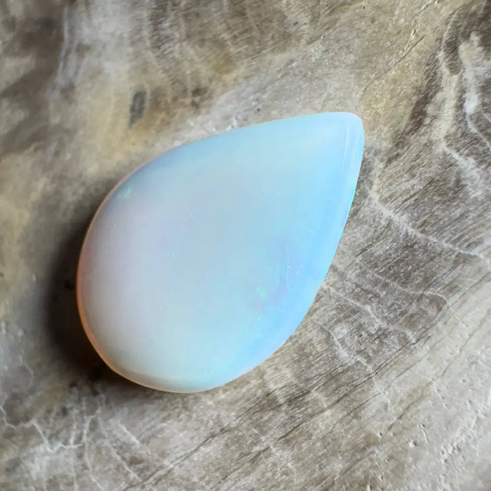Iridescent, teardrop-shaped opal.