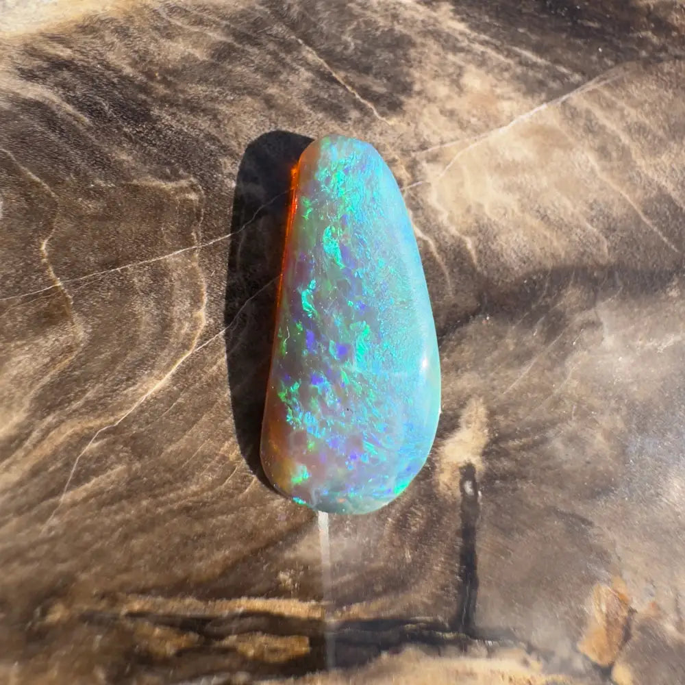 Iridescent blue-green opal gemstone.
