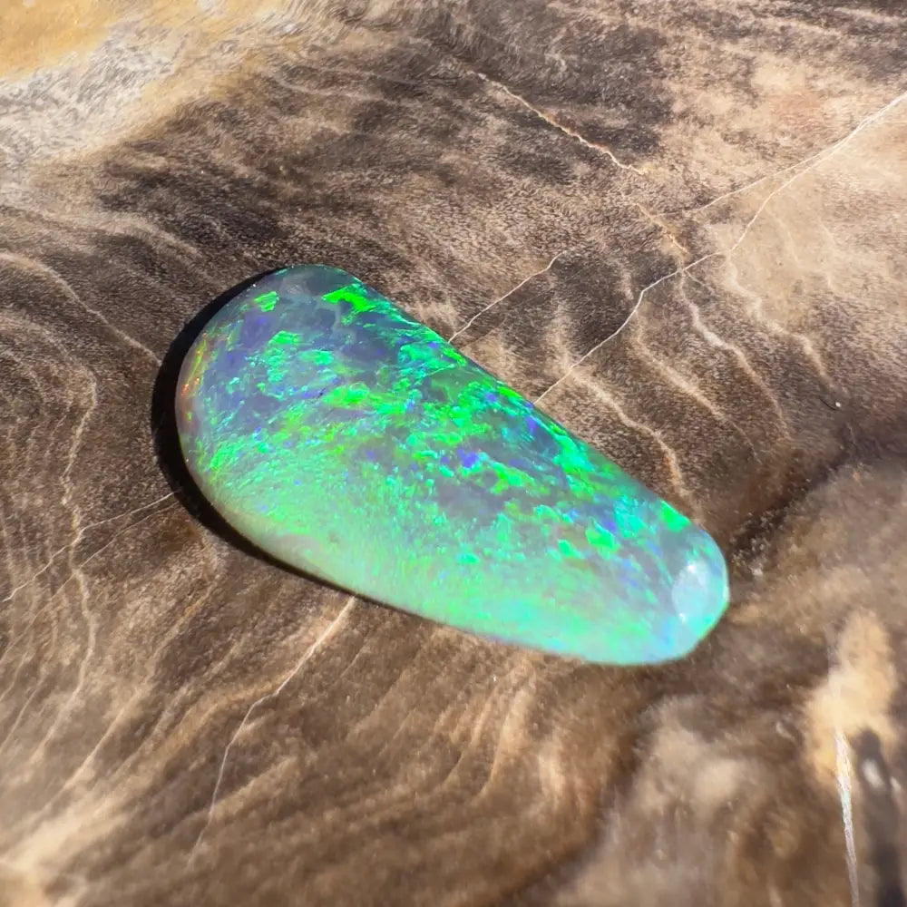 Iridescent green and blue opal gemstone.