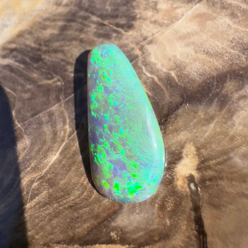 Iridescent green and blue opal gemstone.