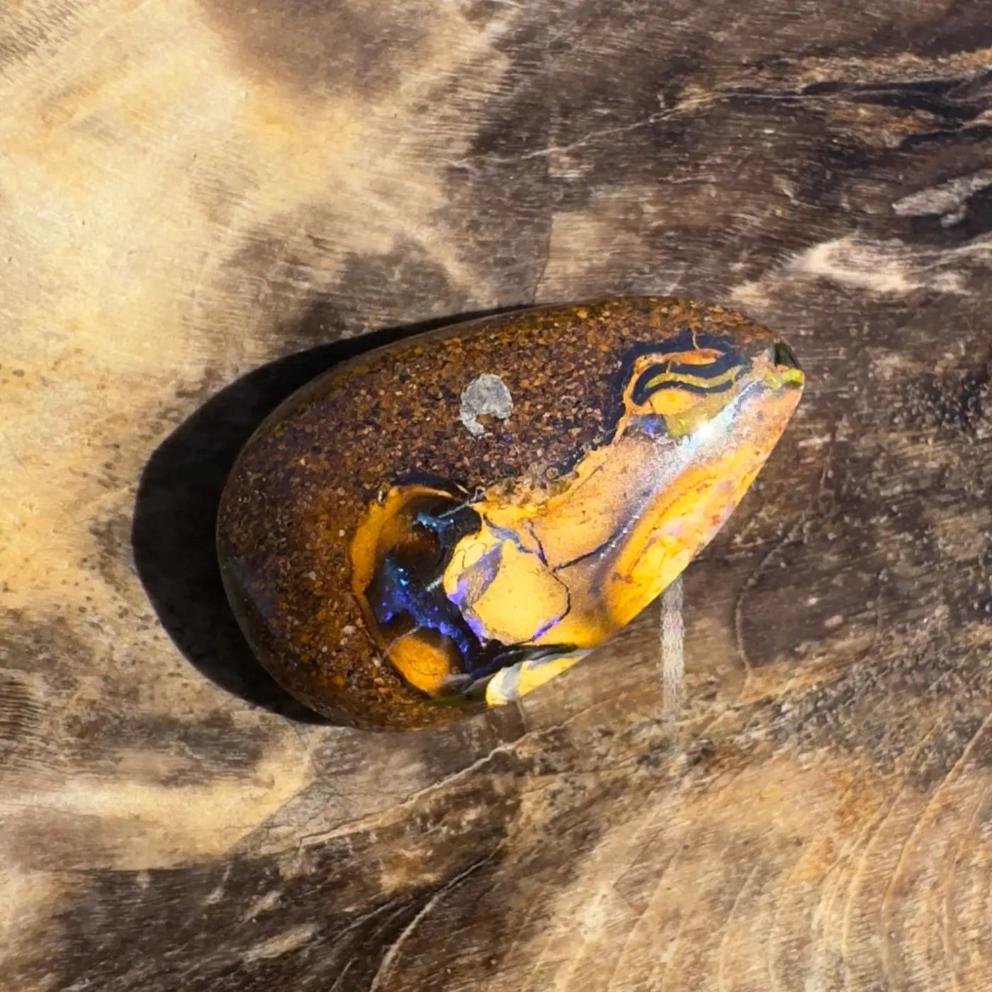 Polished 3.5ct Hand-Cut Solid Boulder Opal showcasing vibrant color play and natural beauty