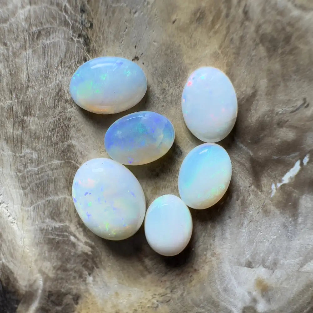 Iridescent oval opals.