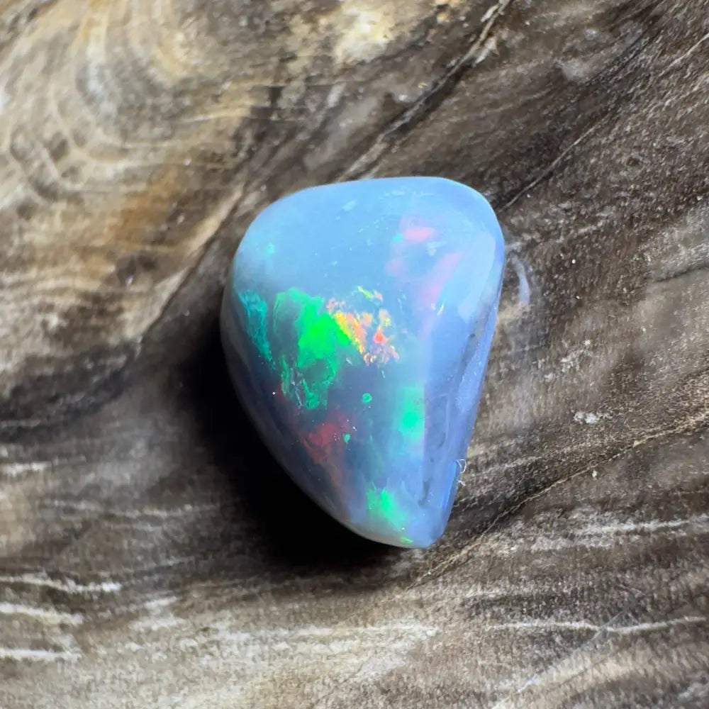 Iridescent blue opal cabochon.
