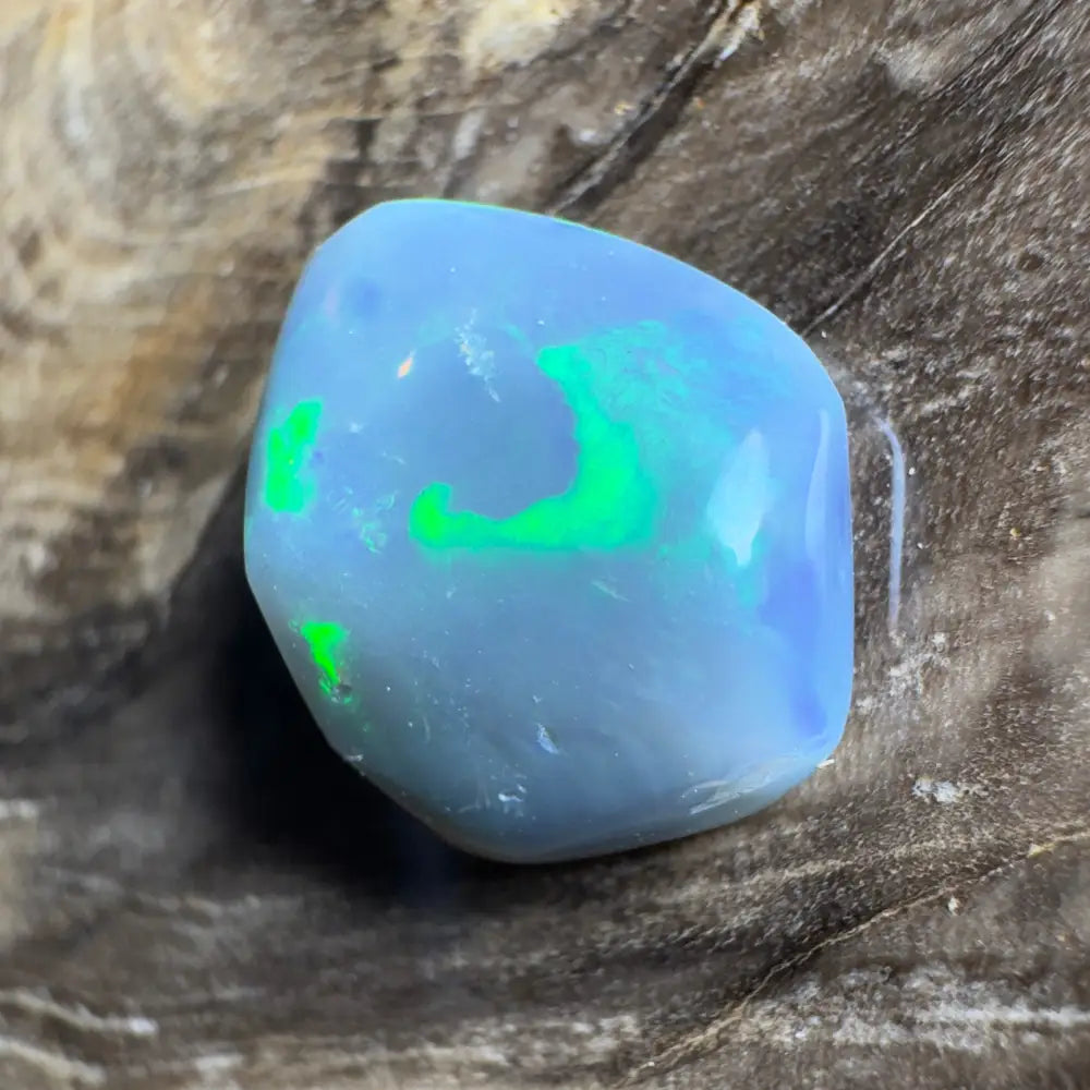 Iridescent blue opal cabochon.