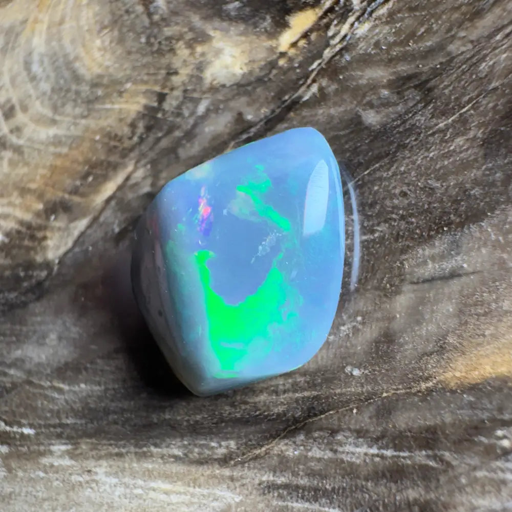 Iridescent blue opal with green and pink flashes.
