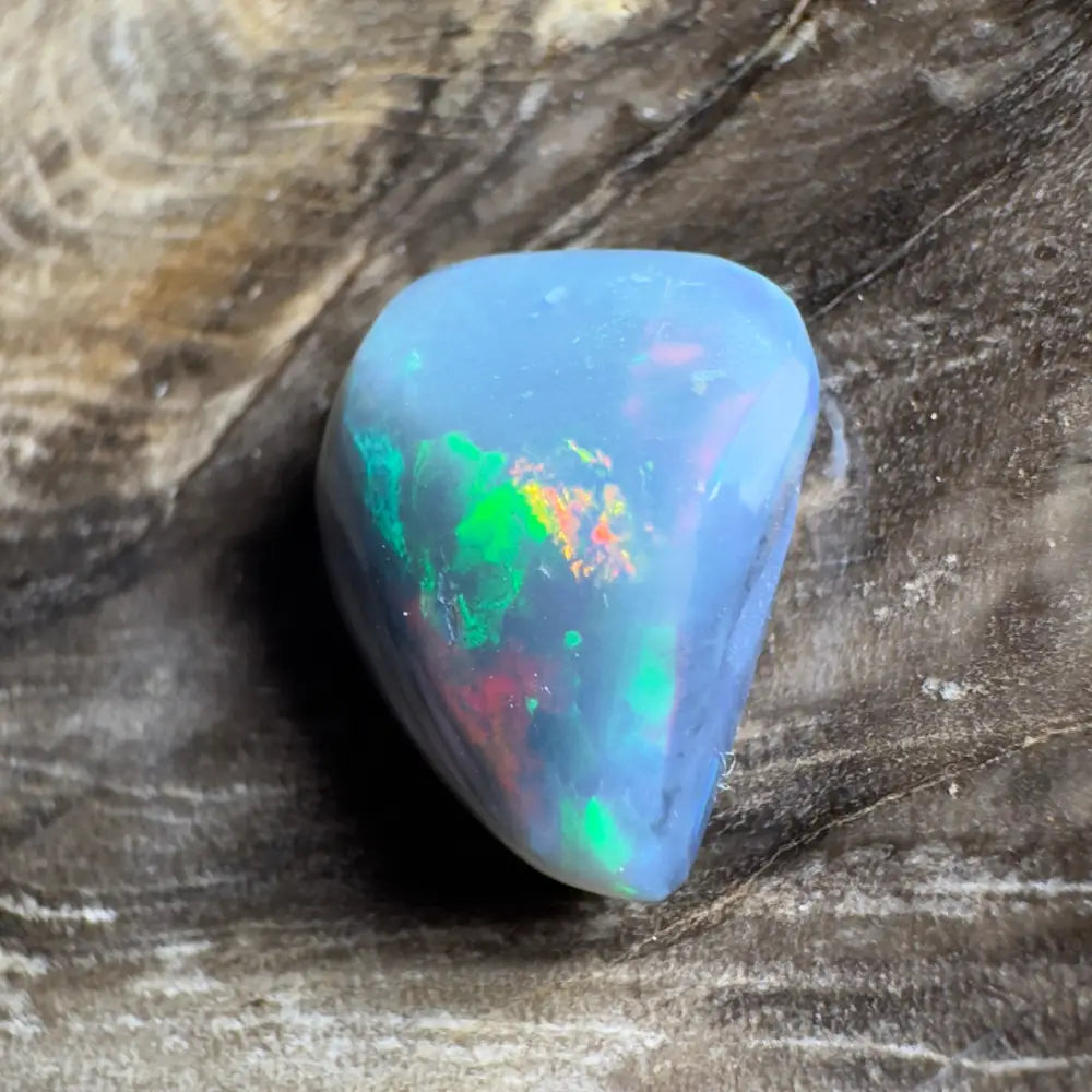 Iridescent blue opal cabochon.