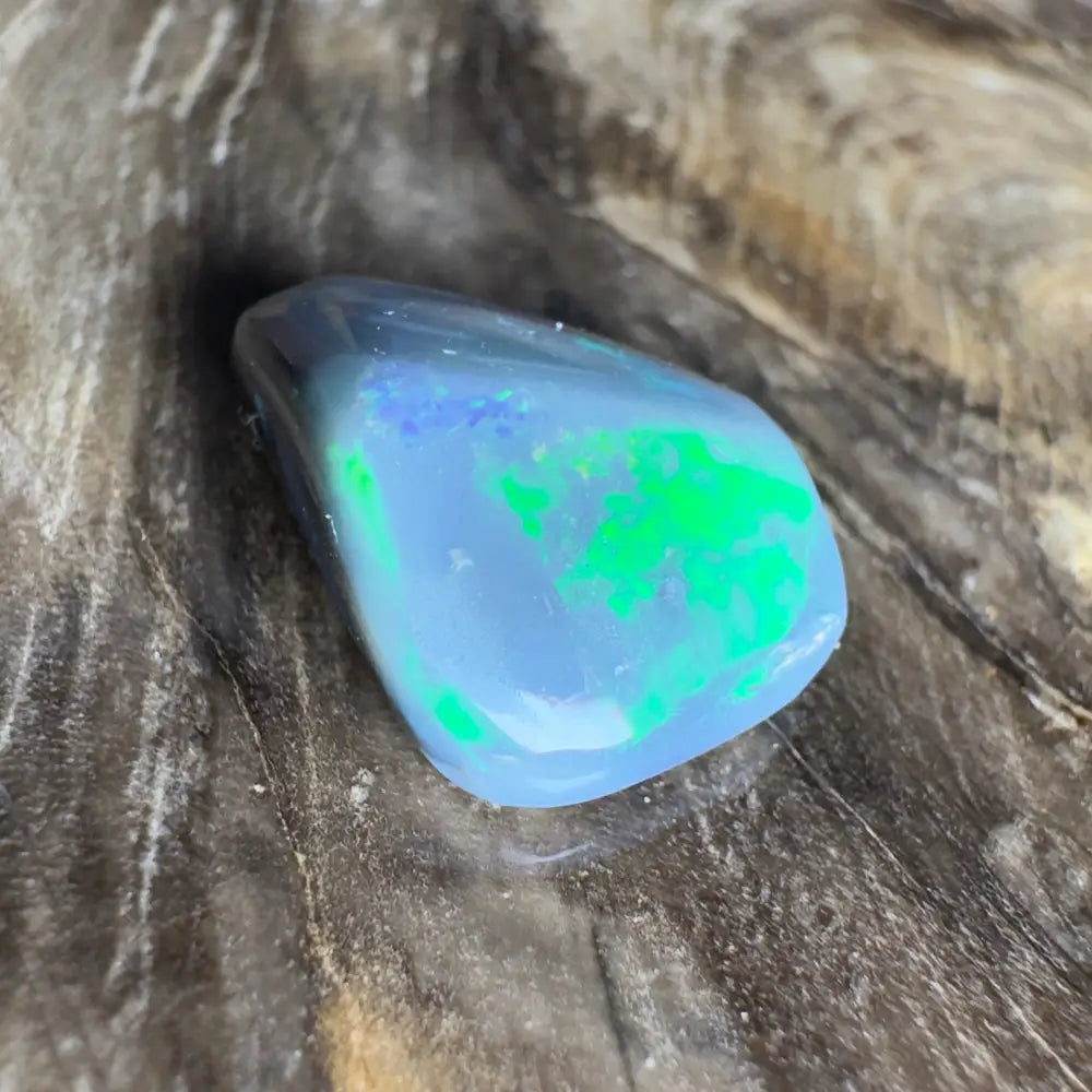Polished opal with green and blue play-of-color.